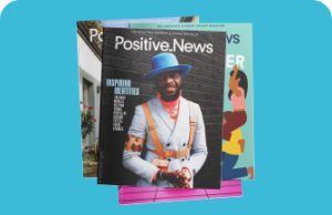 A selection of magazine covers, the one on the top has a photo of a man with a blue hat and white coat. The headline is Positive News